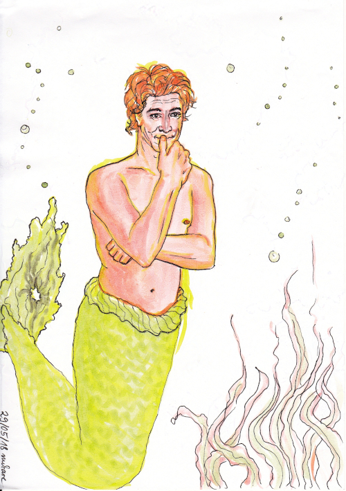 Geoffrey as a mermaid looking amused